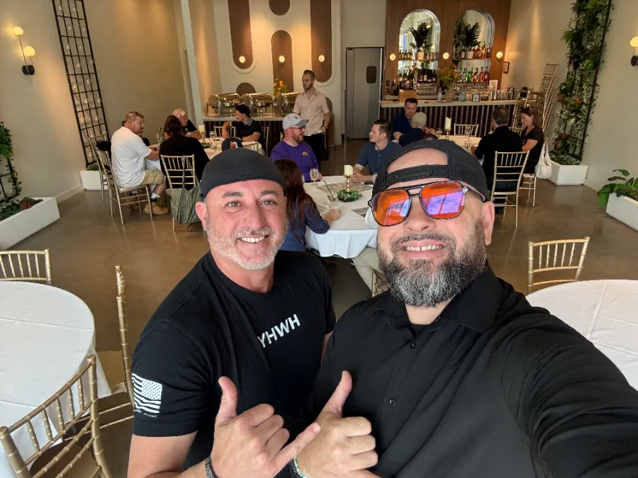 Two TPC leaders welcoming members at a Trusted Team gathering