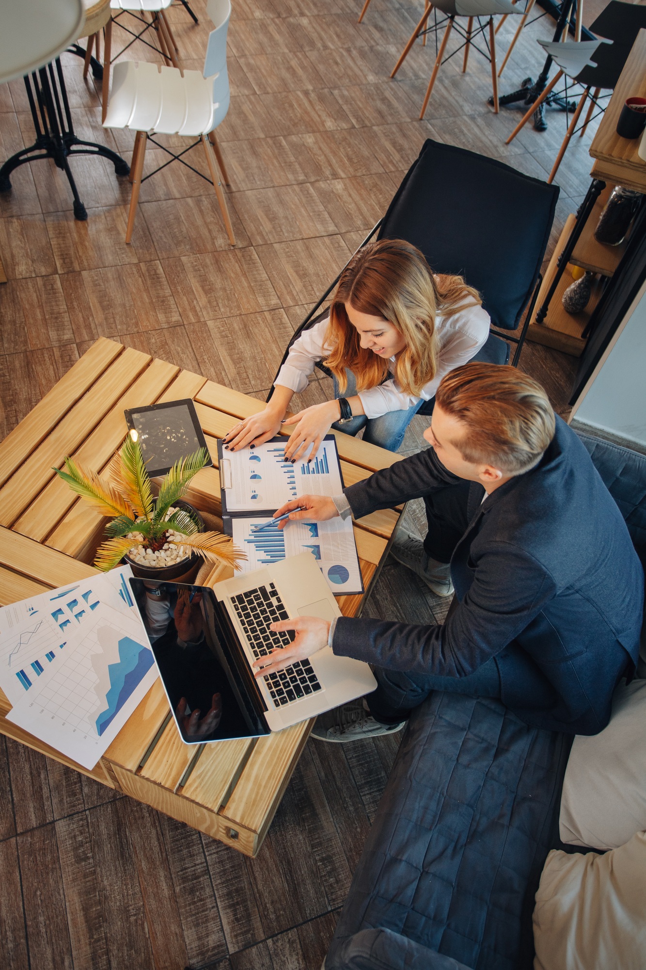 Man and woman have a business meeting in a cafe